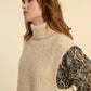 KNITTED SLEEVELESS TURTLENECK SWEATER